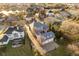 Aerial view of the home and surrounding neighborhood, including a nearby pond at 1997 Finchley Rd, Carmel, IN 46032