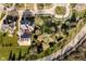 The property showcases lush landscaping, mature trees, and a charming neighborhood setting at 1997 Finchley Rd, Carmel, IN 46032