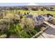 Scenic aerial view of a brick home nestled among mature trees in a picturesque neighborhood at 1997 Finchley Rd, Carmel, IN 46032