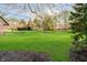Expansive backyard with mature trees creating a private and serene outdoor space at 1997 Finchley Rd, Carmel, IN 46032