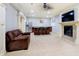 Basement complete with a bar, television, fireplace, and seating area at 1997 Finchley Rd, Carmel, IN 46032