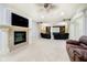 Finished basement features a fireplace and adjacent media area with theater seating at 1997 Finchley Rd, Carmel, IN 46032