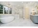 Stunning bathroom features a soaking tub, glass shower, marble accents, and modern gold fixtures at 1997 Finchley Rd, Carmel, IN 46032