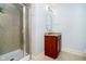 Bathroom featuring a glass shower, vanity with granite counters, and modern fixtures at 1997 Finchley Rd, Carmel, IN 46032