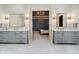 Elegant Primary bathroom with double vanities, marble countertop, and bedroom access at 1997 Finchley Rd, Carmel, IN 46032