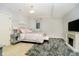 Bright bedroom with a decorative fireplace, soft carpet, and plush bedding at 1997 Finchley Rd, Carmel, IN 46032