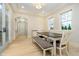 Dining room with modern lighting, large windows, and neutral decor at 1997 Finchley Rd, Carmel, IN 46032