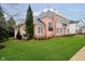 Beautiful home showcasing meticulously maintained lawns and thoughtfully designed landscaping at 1997 Finchley Rd, Carmel, IN 46032