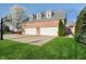 Three-car garage with ample parking space and a well-maintained lawn at 1997 Finchley Rd, Carmel, IN 46032