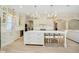 Gourmet kitchen with large island, white cabinetry, modern appliances, and stylish pendant lights at 1997 Finchley Rd, Carmel, IN 46032