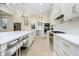 Bright kitchen featuring white cabinets, stainless steel appliances, marble countertops, and pendant lighting at 1997 Finchley Rd, Carmel, IN 46032