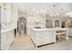 Beautiful kitchen featuring a large center island, white cabinets, and a seamless transition to the living space at 1997 Finchley Rd, Carmel, IN 46032