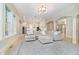 Open-concept living space featuring a large sofa and seamless access to the kitchen and dining area at 1997 Finchley Rd, Carmel, IN 46032