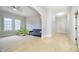 Bright and airy living area with neutral tones, carpet, and ample space for activities at 1997 Finchley Rd, Carmel, IN 46032