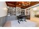 Elegant home office featuring custom built-ins, sophisticated lighting and a sleek desk space at 1997 Finchley Rd, Carmel, IN 46032