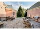 Large brick patio with multiple seating areas and an outdoor grill, perfect for outdoor gatherings at 1997 Finchley Rd, Carmel, IN 46032
