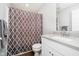 Well-lit bathroom with a modern vanity, decorative shower curtain, and fresh, neutral tones at 19992 Fenside Xing, Westfield, IN 46074