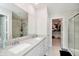 Bright bathroom features a double vanity, large mirror, and glass shower with a walk in closet at 19992 Fenside Xing, Westfield, IN 46074