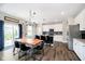 Open dining area with modern lighting, seating for six, and easy access to the kitchen at 19992 Fenside Xing, Westfield, IN 46074