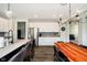A spacious kitchen featuring white cabinets, stainless steel appliances, and an island with seating at 19992 Fenside Xing, Westfield, IN 46074