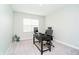 Bright home office space with a large window and neutral decor, creating an ideal work environment at 19992 Fenside Xing, Westfield, IN 46074