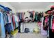 Spacious walk-in closet with built-in shelving and ample storage for clothes and accessories at 19992 Fenside Xing, Westfield, IN 46074