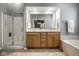 Bathroom featuring a double sink vanity, glass enclosed shower and a soaking tub at 2067 Rhettsbury St, Carmel, IN 46032