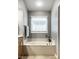 A bathroom showing a soaking tub with tile surround and a gray painted wall at 2067 Rhettsbury St, Carmel, IN 46032