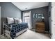 Bedroom featuring blue accents, neutral walls, and a double hung window for natural light at 2067 Rhettsbury St, Carmel, IN 46032