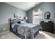 Comfortable bedroom with a bed, dresser, carpet and a window with natural light at 2067 Rhettsbury St, Carmel, IN 46032