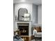 Close-up of the fireplace with decorative mantel, adding warmth and character to the living space at 2067 Rhettsbury St, Carmel, IN 46032