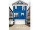 Bright blue home with a two-car garage and a well-kept lawn at 2067 Rhettsbury St, Carmel, IN 46032