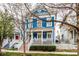 Charming blue two-story house with a lovely front porch and garden at 2067 Rhettsbury St, Carmel, IN 46032