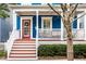 Inviting front porch with a red door, white railings, and comfortable seating area to relax and unwind at 2067 Rhettsbury St, Carmel, IN 46032