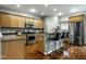 Well-lit kitchen featuring stainless steel appliances, wood cabinets, granite countertops and an eat-in island at 2067 Rhettsbury St, Carmel, IN 46032