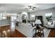 Spacious living room with hardwood floors, a cozy fireplace, and plenty of natural light at 2067 Rhettsbury St, Carmel, IN 46032
