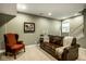 Finished basement with couch, a red chair, carpet and a window with natural light at 2067 Rhettsbury St, Carmel, IN 46032