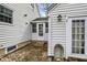Brick-paved area with a door leading into the home; charming exterior at 214 W Elbert St, Indianapolis, IN 46217