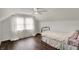 Bright bedroom featuring hardwood floors, large windows and a ceiling fan at 214 W Elbert St, Indianapolis, IN 46217