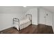 Bright bedroom with hardwood floors, a bed, window and closet, bathed in natural light at 214 W Elbert St, Indianapolis, IN 46217