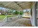 Large wooden deck with white railings, hot tub, and views of the lawn at 214 W Elbert St, Indianapolis, IN 46217