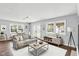 Bright living room features hardwood floors, modern furniture, and large windows at 214 W Elbert St, Indianapolis, IN 46217