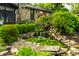 Backyard pond with waterfall and lush landscaping at 224 Brierley Way, Carmel, IN 46032
