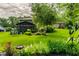 Expansive lawn with mature trees and lush landscaping, providing a private outdoor retreat at 224 Brierley Way, Carmel, IN 46032