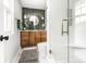 Modern bathroom featuring stylish green tile accent wall and glass enclosed shower at 224 Brierley Way, Carmel, IN 46032