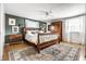 Spacious bedroom with hardwood floors, a ceiling fan, and natural light at 224 Brierley Way, Carmel, IN 46032