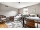 Bright bedroom with two twin beds, a patterned rug, and charming decor at 224 Brierley Way, Carmel, IN 46032