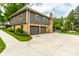 Two story home with a stone and siding exterior and large driveway at 224 Brierley Way, Carmel, IN 46032