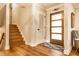 Entryway with wood flooring, stairs, and a stylish front door creating a welcoming space at 224 Brierley Way, Carmel, IN 46032