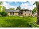 Charming home with manicured lawn, stone accents, and gray siding, offering great curb appeal at 224 Brierley Way, Carmel, IN 46032